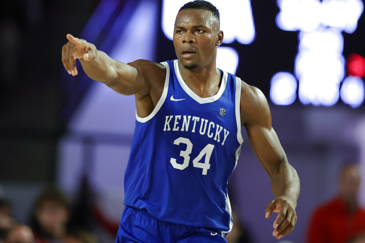 Kentucky forward Oscar Tshiebwe motions down court during the second half of an NCAA college basketball game against Georgia, Saturday, Feb. 11, 2023, in Athens, Ga.