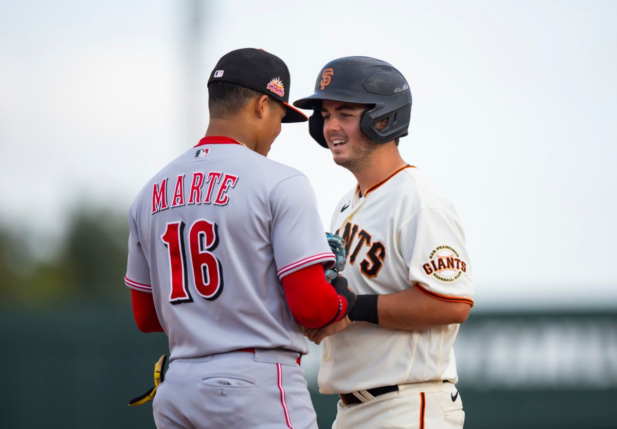 Cincinnati Reds infielder Noelvi Marte (16) and SF Giants catcher Andy Thomas during an Arizona Fall League game. (2022)