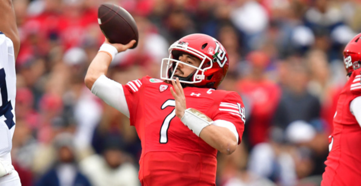 Utah Utes quarterback Cameron Rising attempts a pass during a college football game.