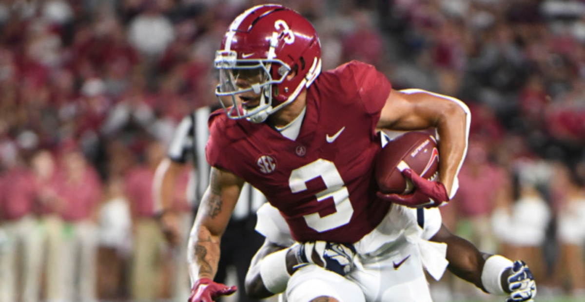 Alabama Crimson Tide wide receiver Jermaine Burton catches a pass during a college football game in the SEC.