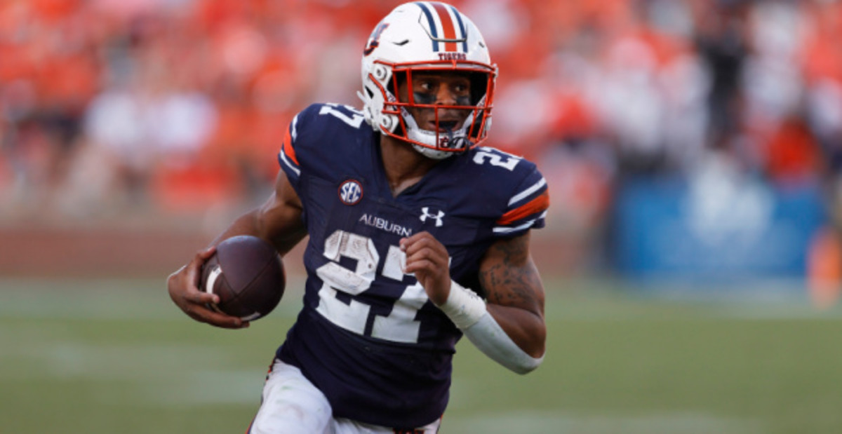 Auburn Tigers tailback Jarquez Hunter on a rushing attempt during a college football game in the SEC.