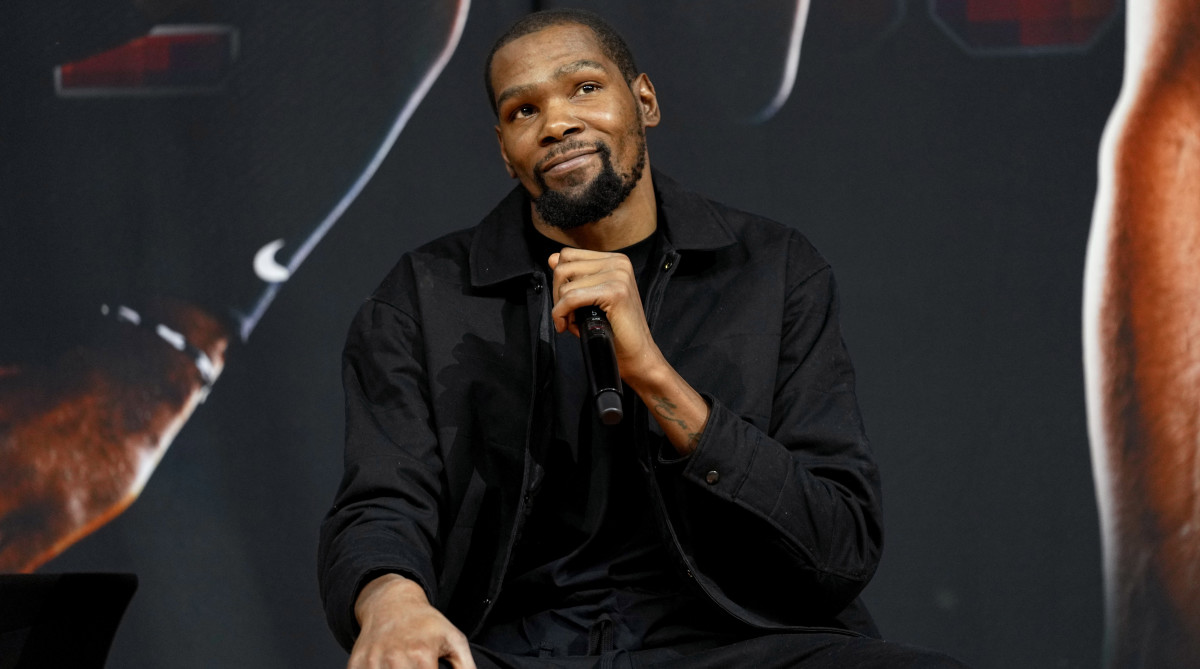 Suns forward Kevin Durant smiles after being introduced.
