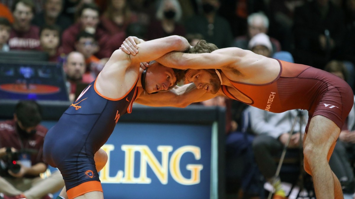 Wrestlers from the Virginia and Virginia Tech wrestling teams compete against one another during a dual meet at Memorial Gymnasium.