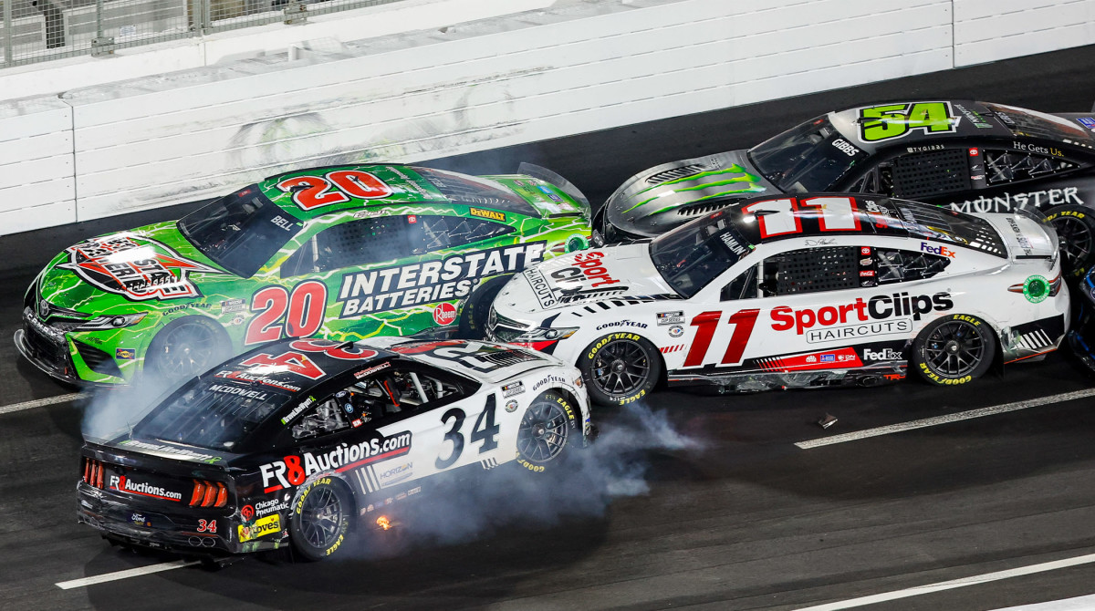 NASCAR Cup Series driver Michael McDowell (34) spins in front of Christopher Bell (20), Denny Hamlin (11) and Ty Gibbs (54) during the NASCAR Busch Light Clash at the Coliseum