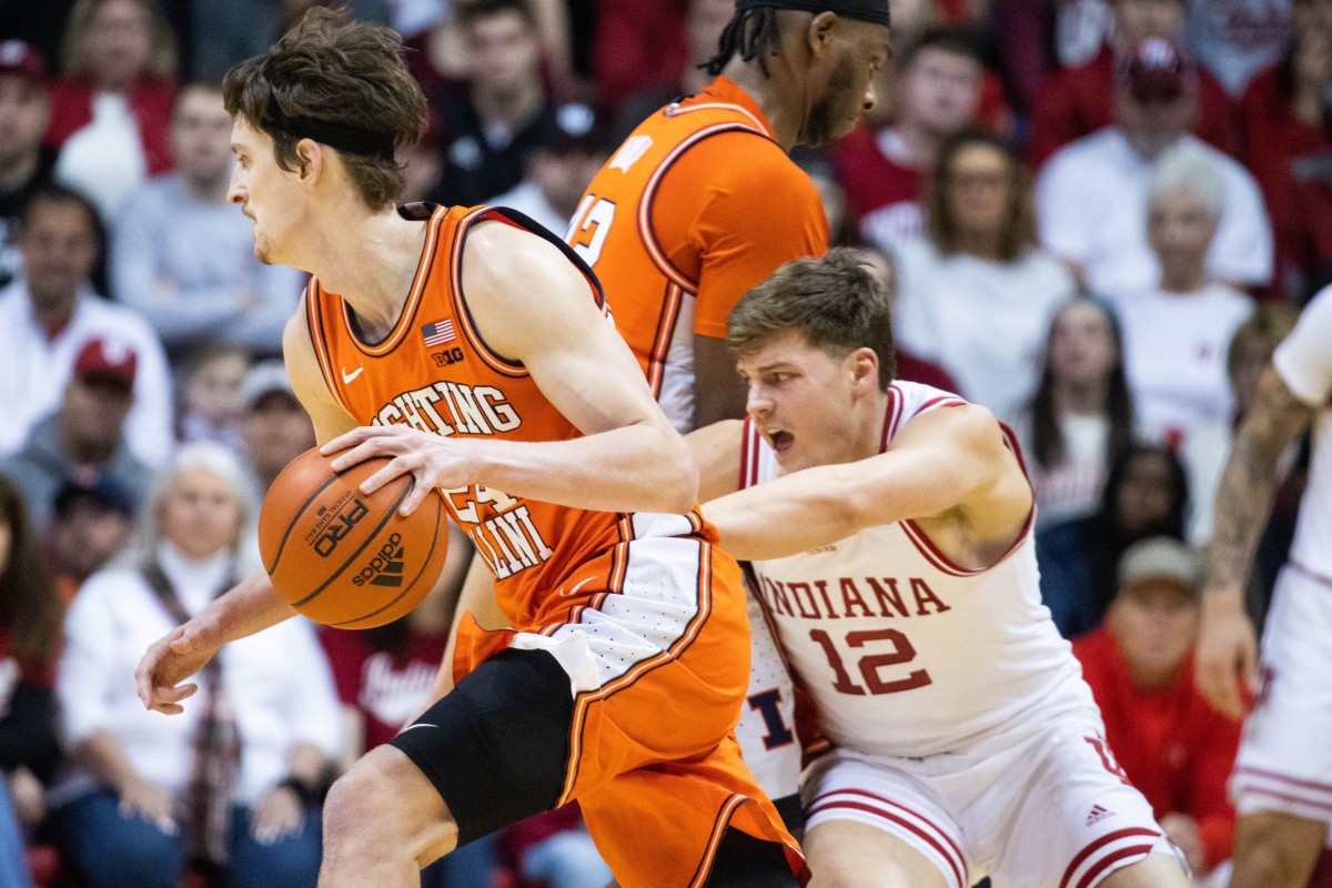 Illinois Fighting Illini forward Matthew Mayer (24) dribbles the ball while Indiana Hoosiers forward Miller Kopp (12) defends.