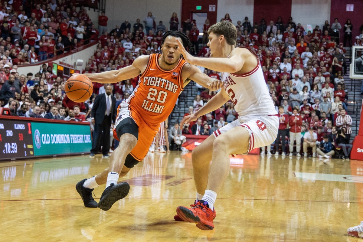Illinois Fighting Illini forward Ty Rodgers (20) dribbles the ball while Indiana Hoosiers forward Miller Kopp (12) defends in the second half.