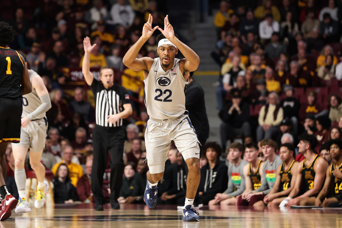 Penn State point guard reacts after making a basket against Minnesota in a Big Ten Conference basketball game.