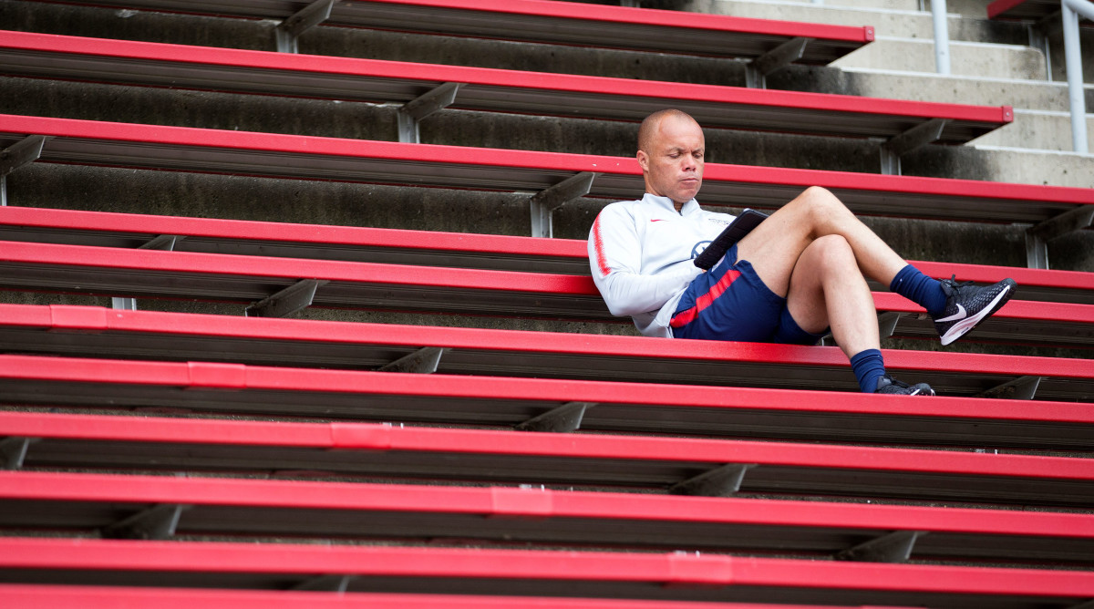 Earnie Stewart sitting in the stands at USMNT camp.