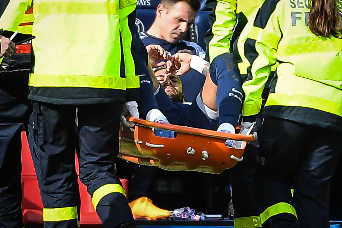 Neymar pictured leaving the field on a stretcher after suffering an ankle injury in PSG's Ligue 1 game against Lille in February 2023