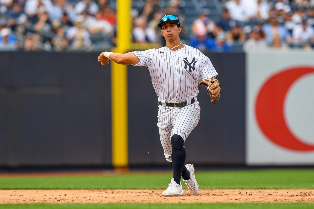 New York Yankees infielder Oswaldo Cabrera makes throw on infield