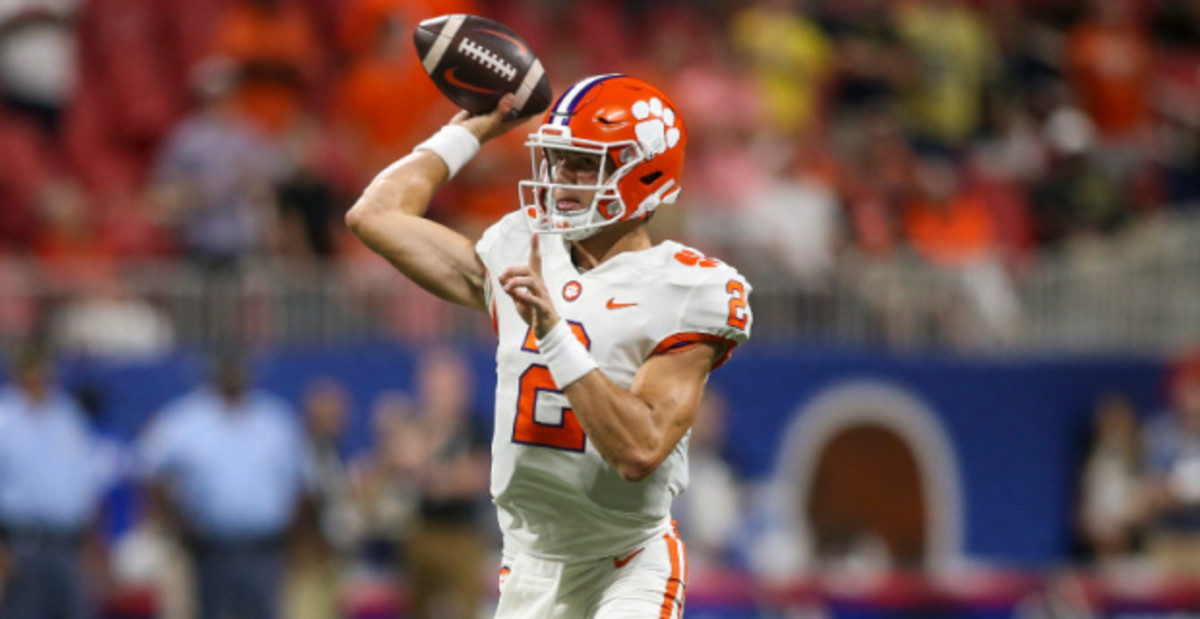 Clemson Tigers quarterback Cade Klubnik attempts a pass during a college football game in the ACC.