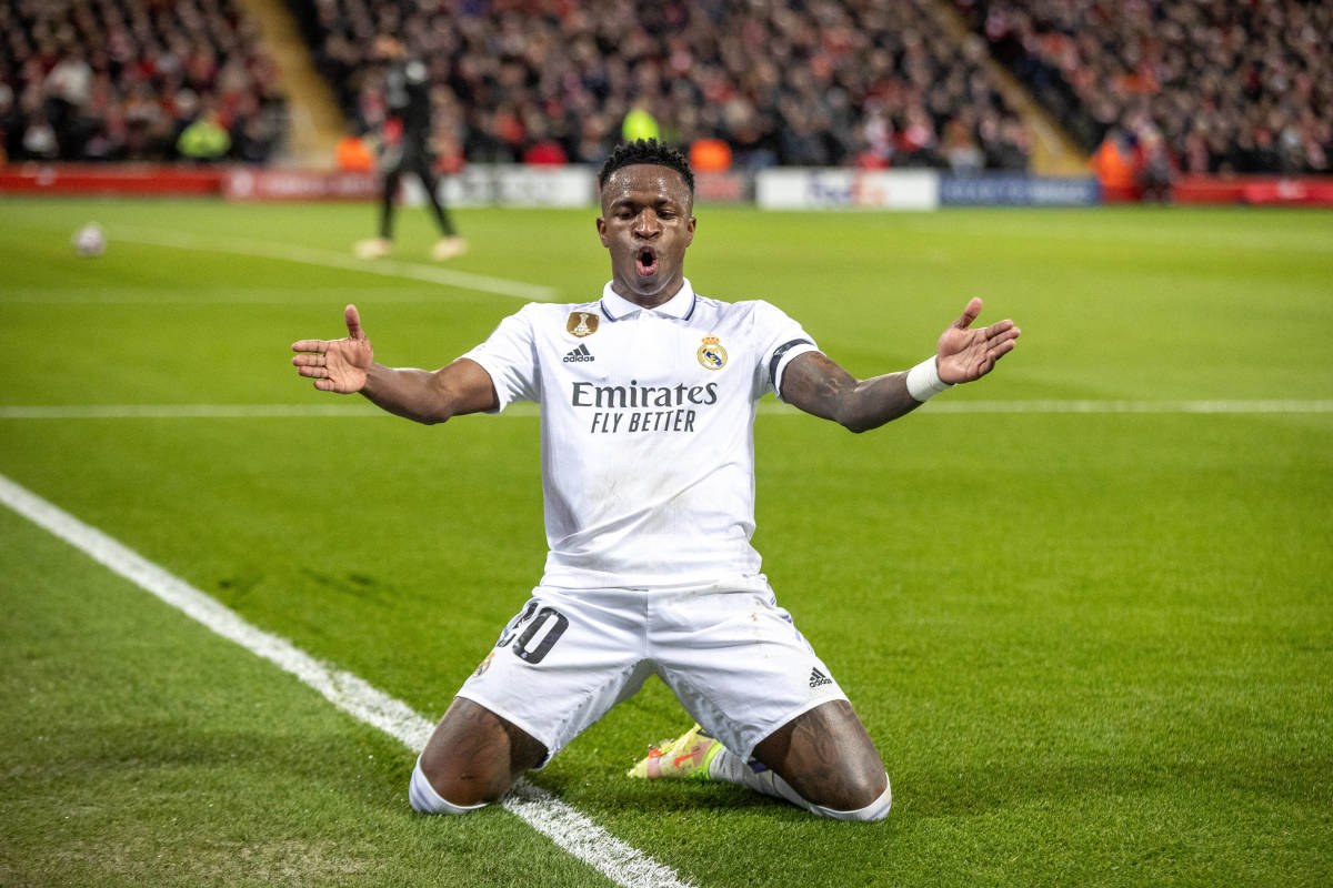 Vinicius Junior pictured celebrating after scoring a lucky goal for Real Madrid against Liverpool in February 2023 following a mistake by keeper Alisson Becker