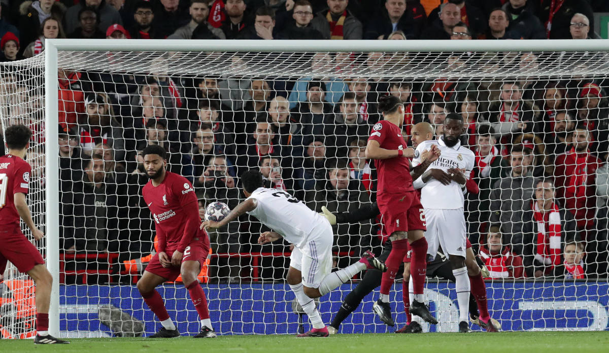 Eder Militao pictured (center) scoring a headed goal for Real Madrid against Liverpool at Anfield in February 2023