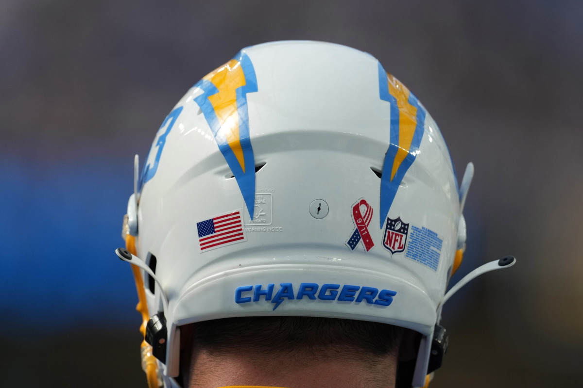 Sep 11, 2022; Inglewood, California, USA; A detailed view of the 9/11 ribbon logo on the back of the helmet of Los Angeles Chargers center Corey Linsley (63) during the game against the Las Vegas Raiders at SoFi Stadium. Mandatory Credit: Kirby Lee-USA TODAY Sports
