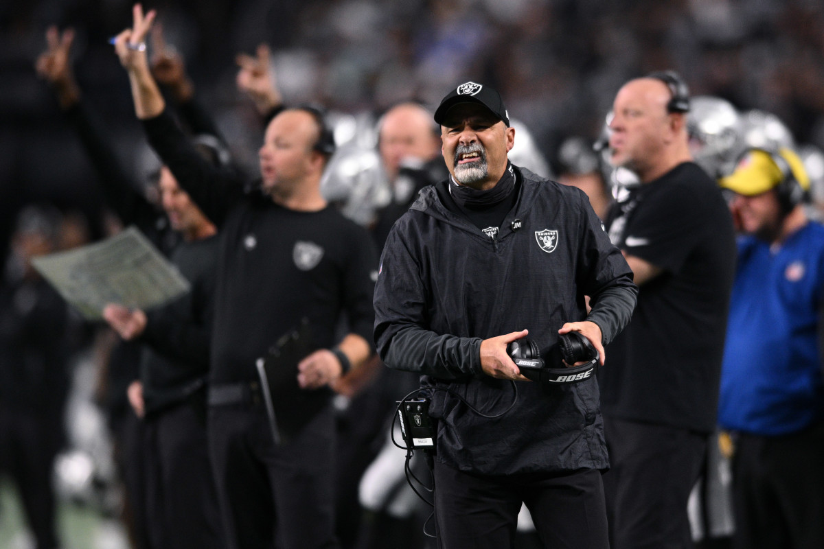 Jan 9, 2022; Paradise, Nevada, USA; Las Vegas Raiders head coach Rich Bisaccia (front) looks on from the sideline during the first quarter against the Los Angeles Chargers at Allegiant Stadium.