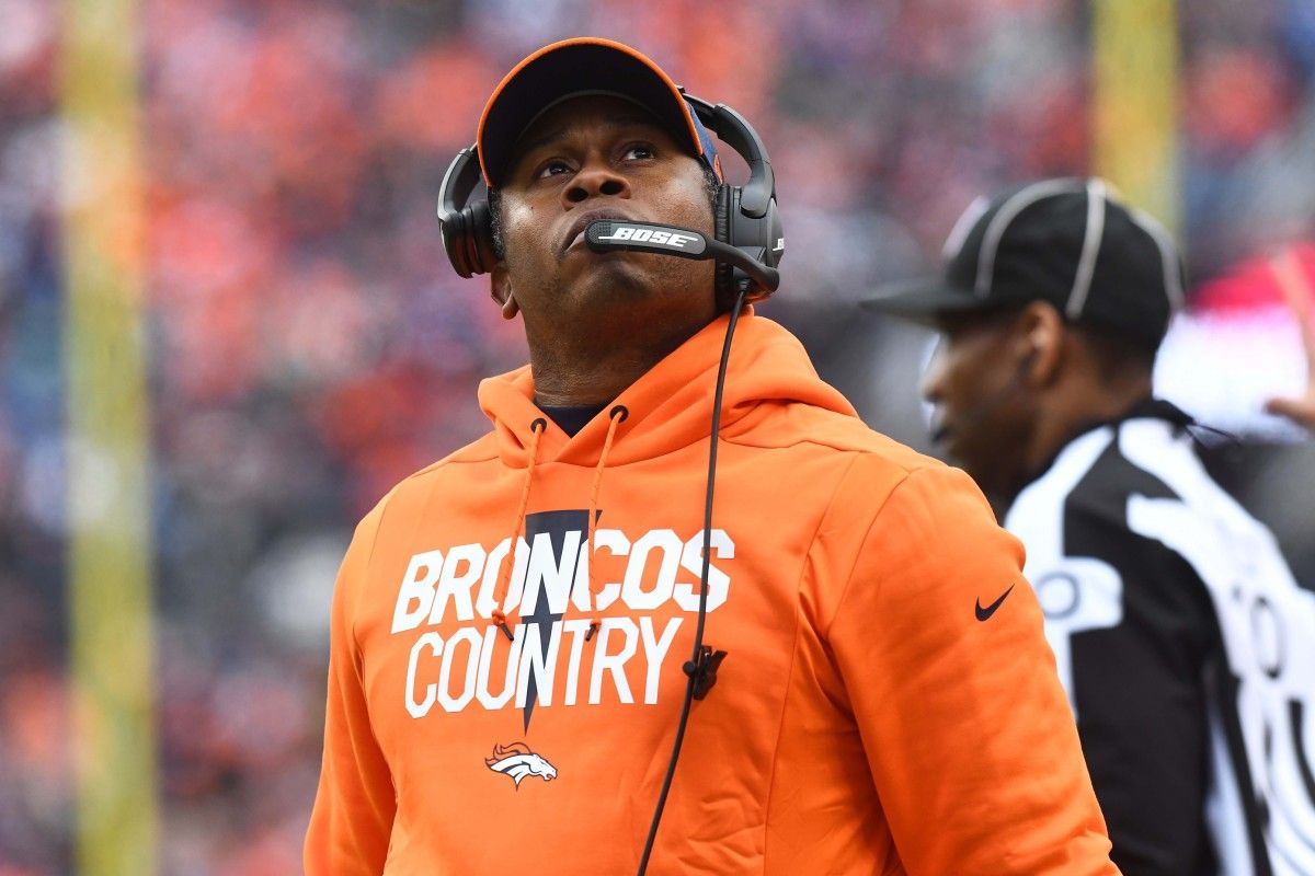 Denver Broncos head coach Vance Joseph looks at the video board in the first half against the Los Angeles Chargers at Broncos Stadium at Mile High.