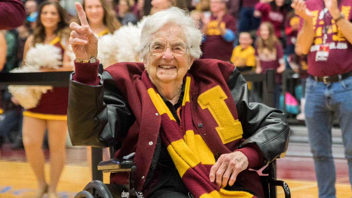 Loyola Ramblers team chaplain Sister Jean Dolores-Schmidt celebrates at the Gentile Arena after capturing the NCAA South Regional Championship.