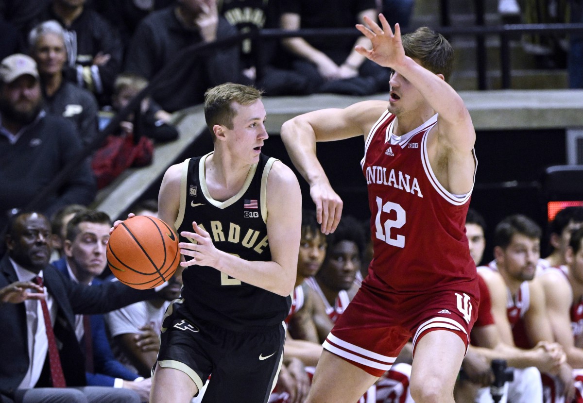 Purdue Boilermakers guard Fletcher Loyer (2) controls the ball against Indiana Hoosiers forward Miller Kopp (12) during the first half at Mackey Arena.
