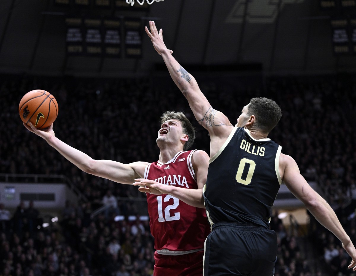 Indiana Hoosiers forward Miller Kopp (12) shoots the ball against Purdue Boilermakers forward Mason Gillis (0) during the first half at Mackey Arena.