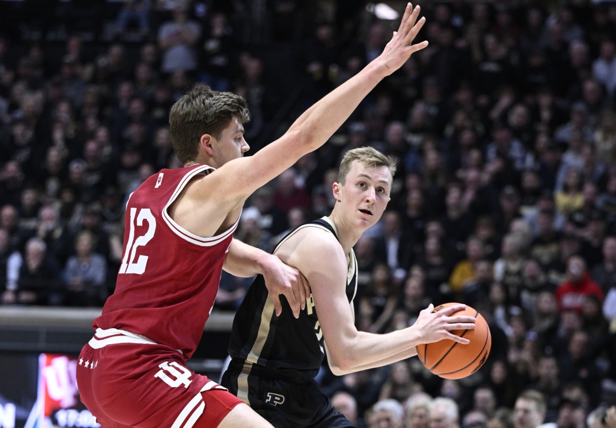 Purdue Boilermakers guard Fletcher Loyer (2) controls the ball against Indiana Hoosiers forward Miller Kopp (12) during the second half at Mackey Arena.