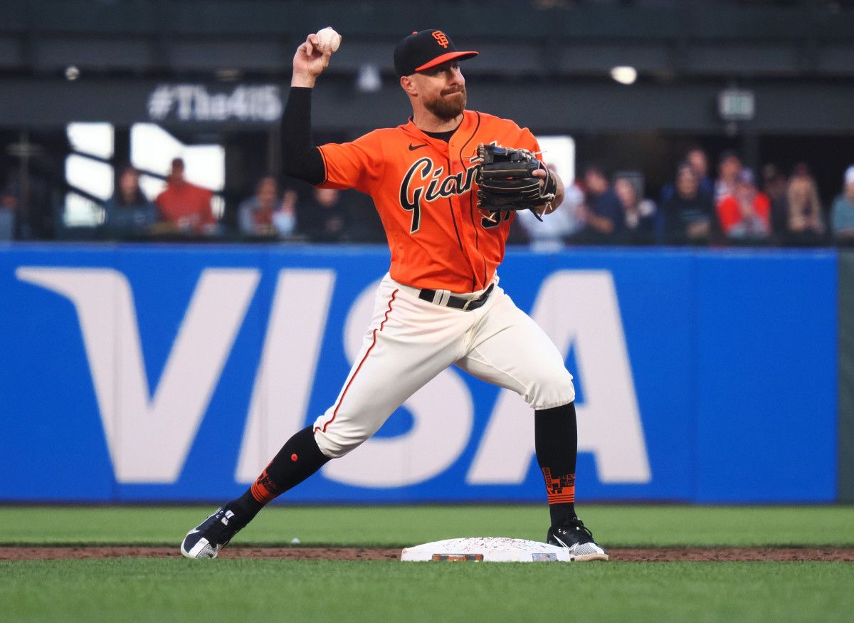 SF Giants second baseman Donovan Walton (37) turns a double play against the Cincinnati Reds. (2022)