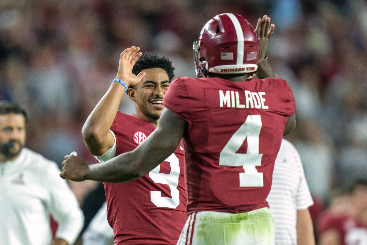 Tuscaloosa, Alabama, USA; Alabama Crimson Tide quarterback Jalen Milroe (4) celebrates with quarterback Bryce Young (9) after scoring a touchdown against the Texas A&M Aggies during the first half at Bryant-Denny Stadium.