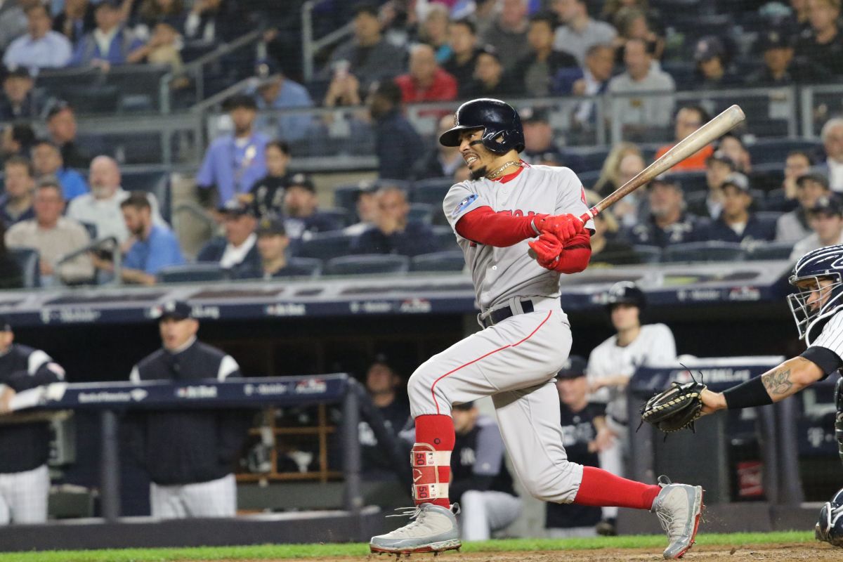 Mookie Betts finishes his swing