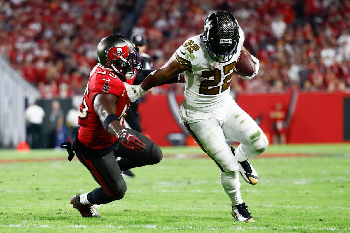Dec 5, 2022; New Orleans Saints running back Mark Ingram II (22) runs with the ball as Tampa Bay Buccaneers linebacker Devin White (45) defends. Mandatory Credit: Douglas DeFelice-USA TODAY Sports