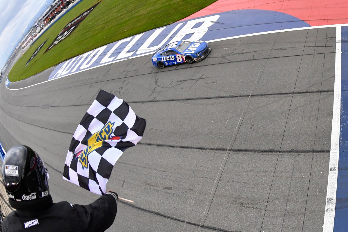 Kyle Busch takes the checkered flag to win the Pala Casino 400 at Auto Club Speedway in Fontana, California. (Photo by Logan Riely/Getty Images)