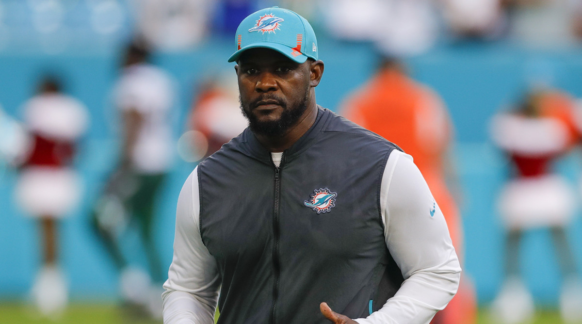 Dolphins head coach Brian Flores runs off the field after winning the game against the New York Jets at Hard Rock Stadium.