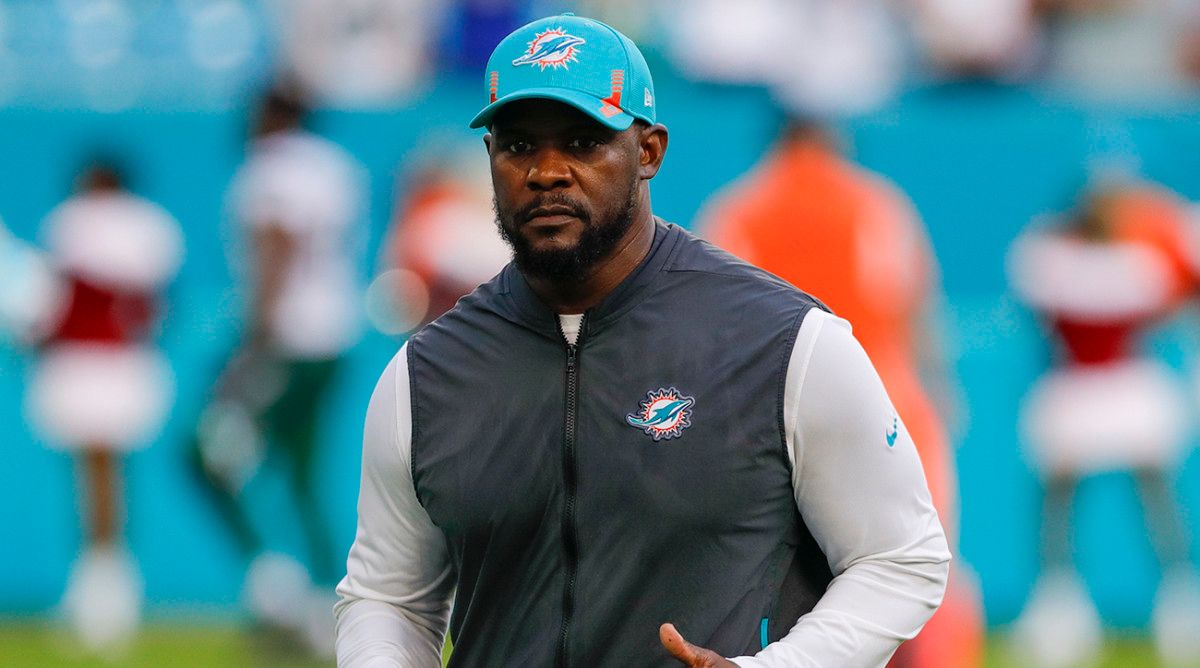 Dolphins head coach Brian Flores runs off the field after winning the game against the New York Jets at Hard Rock Stadium.