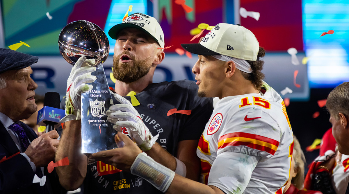 Kansas City Chiefs quarterback Patrick Mahomes (right) and tight end Travis Kelce celebrate with the Vince Lombardi Trophy after defeating the Philadelphia Eagles during Super Bowl LVII
