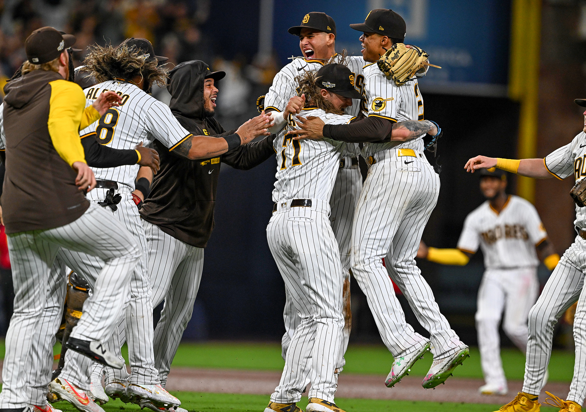 Padres players celebrate a playoff series win.