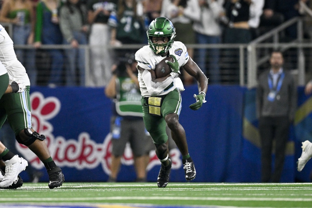 Jan 2, 2023; Arlington, Texas, USA; Tulane Green Wave running back Tyjae Spears (22) in action during the game between the USC Trojans and the Tulane Green Wave in the 2023 Cotton Bowl at AT&T Stadium. Mandatory Credit: Jerome Miron-USA TODAY Sports