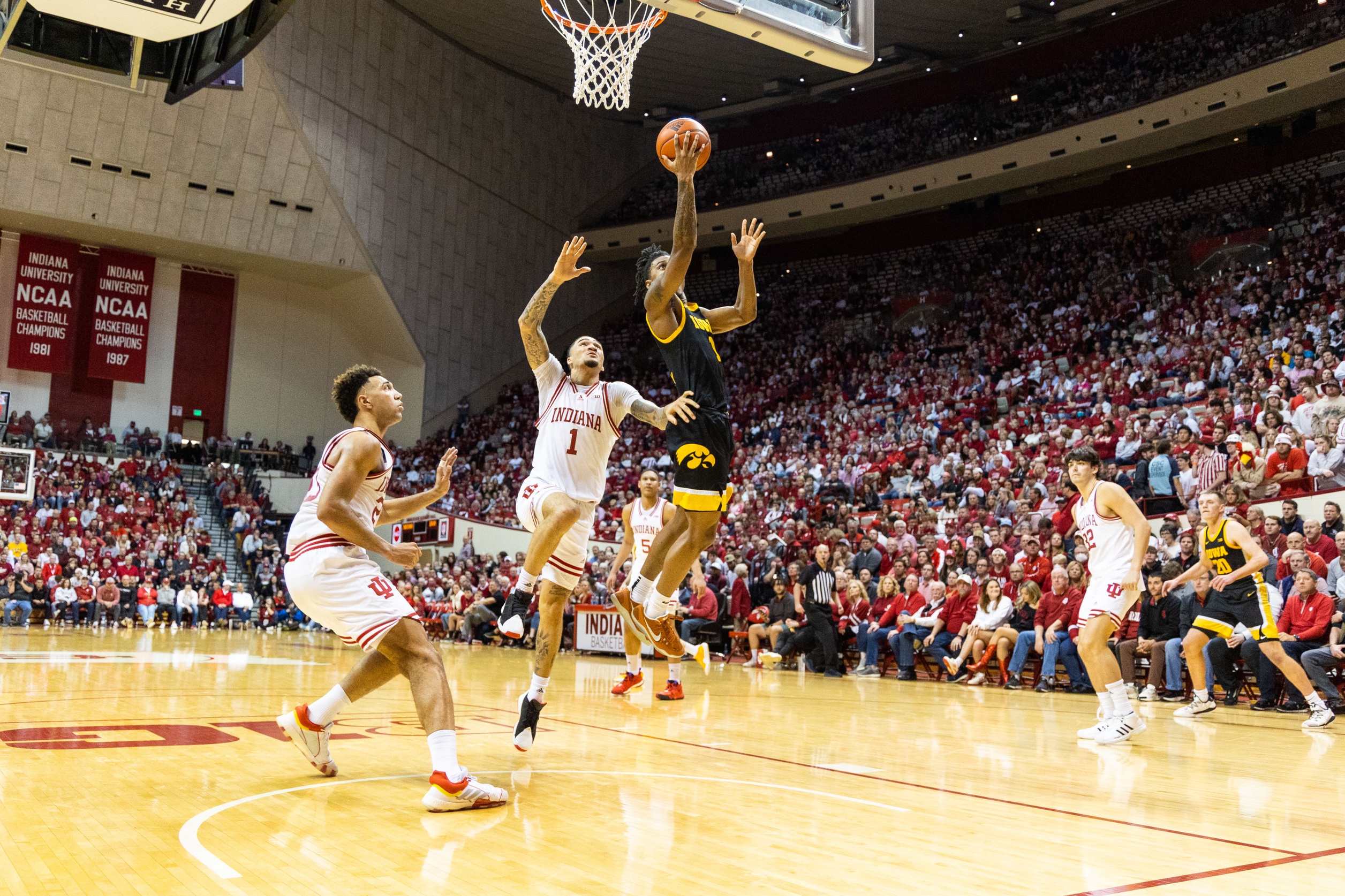 Iowa Hawkeyes guard Ahron Ulis (1) shoots the ball while Indiana Hoosiers guard Jalen Hood-Schifino (1) defends in the second half at Simon Skjodt Assembly Hall.