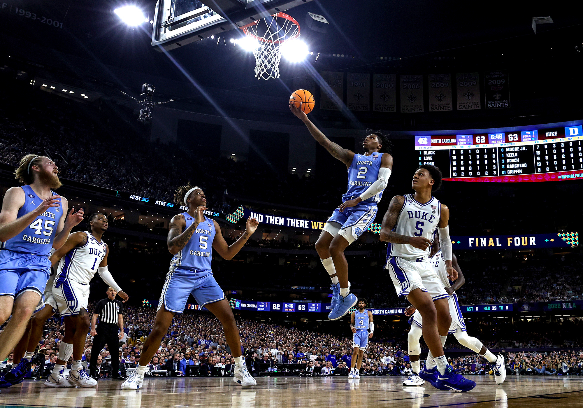 A UNC player goes in for a lay-up against Duke.