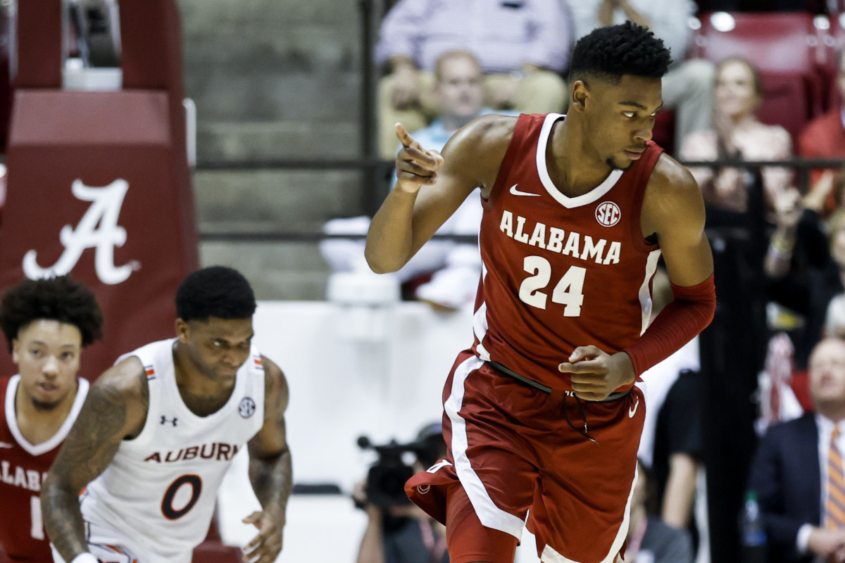 Alabama Crimson Tide forward Brandon Miller (24) reacts after making a three pointer against the Auburn Tigers during the first half of an NCAA basketball game at Coleman Coliseum.