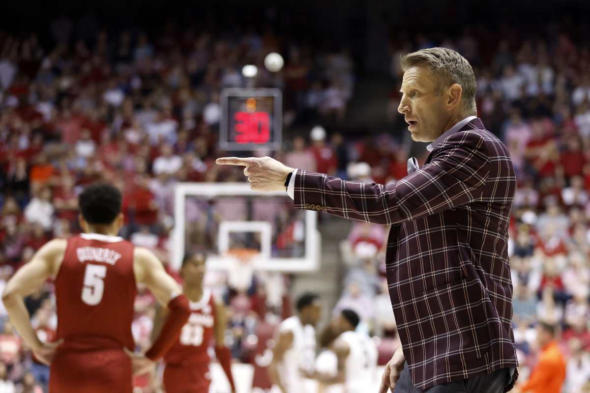 Alabama Crimson Tide head coach Nate Oats reacts to a call against the Auburn Tigers during the first half of an NCAA basketball game at Coleman Coliseum.