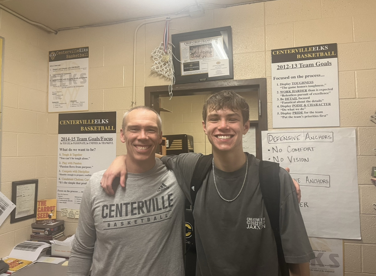 Centerville basketball coach Brook Cupps (left) and his son, point guard and Indiana basketball commit, Gabe Cupps (right), together after the Elks' 90-43 win over Springboro on Jan. 3, 2023.