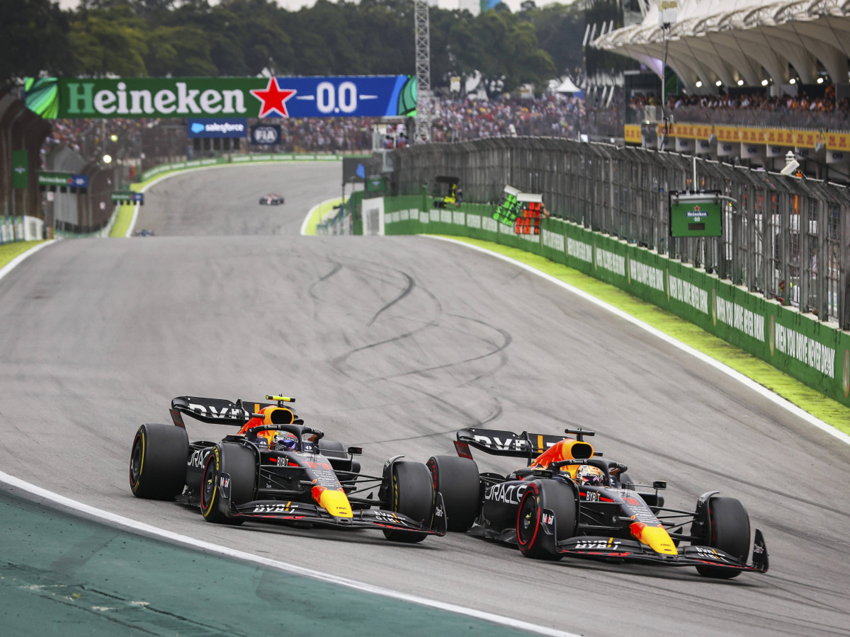 Sergio Perez and Max Verstappen drive next to each other in Brazil.