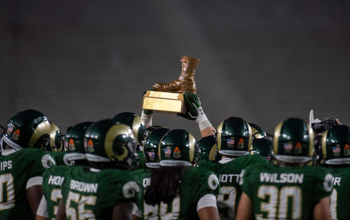 The Colorado State Rams raise the Bronze Boot, a traveling trophy for the winner of the annual Border War football game between Colorado State and Wyoming, after winning the game at Colorado State University in Fort Collins, Colo. on Thursday, Nov. 5, 2020 at Canvas Stadium. 110520 Csuvwyfb 12 Bb
