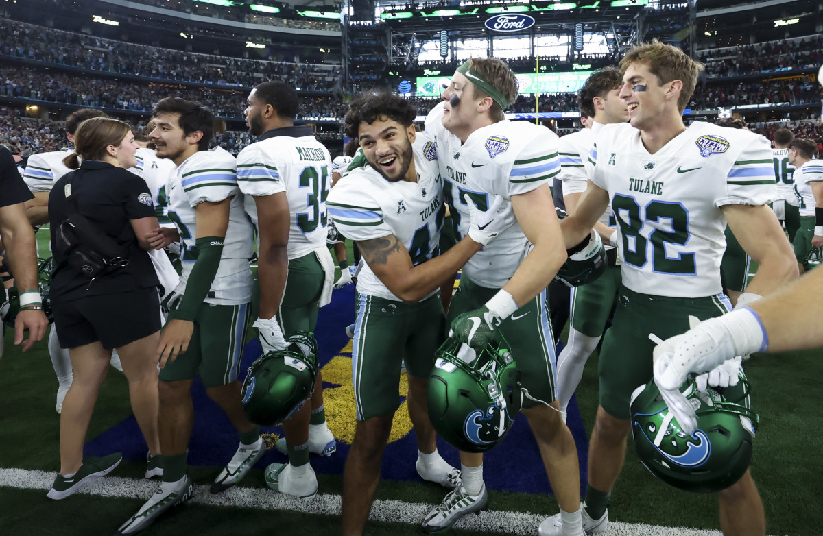 Jan 2, 2023; Arlington, Texas, USA; Tulane Green Wave players celebrate after the victory against the USC Trojans in the 2023 Cotton Bowl at AT&T Stadium.
