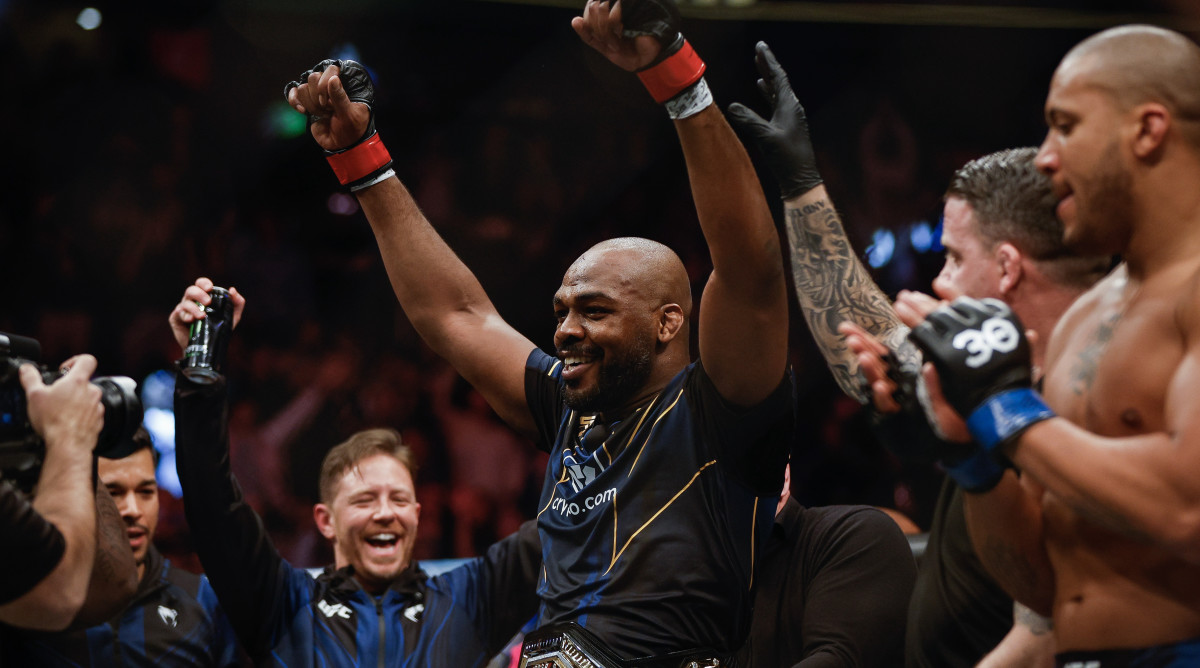 Jon Jones celebrates after winning the main event of UFC 285 over Ciryl Gane