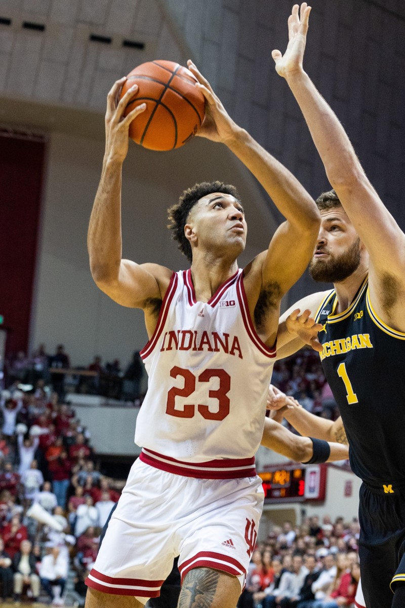 Indiana Hoosiers forward Trayce Jackson-Davis (23) shoots the ball while Michigan Wolverines center Hunter Dickinson (1) defends in the first half at Simon Skjodt Assembly Hall.