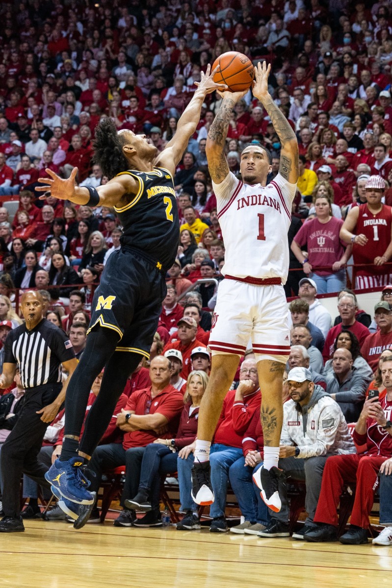 Jalen Hood-Schifino (1) shoots the ball while Michigan Wolverines guard Kobe Bufkin (2) defends in the first half at Simon Skjodt Assembly Hall.