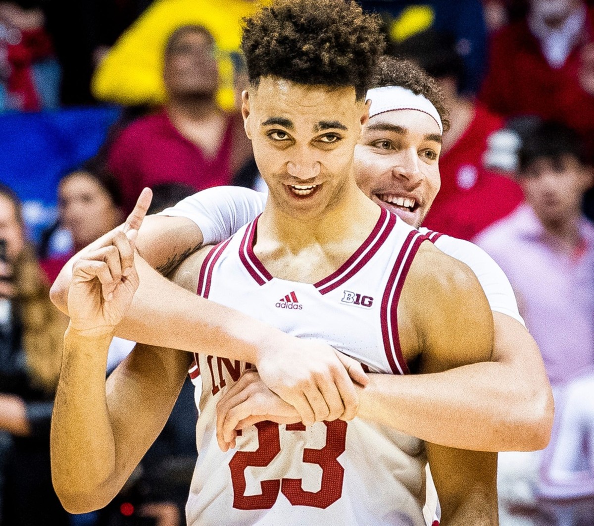 Trayce Jackson-Davis (23) and Race Thompson (25) celebrate the victory after overtime of Indiana versus Michigan.
