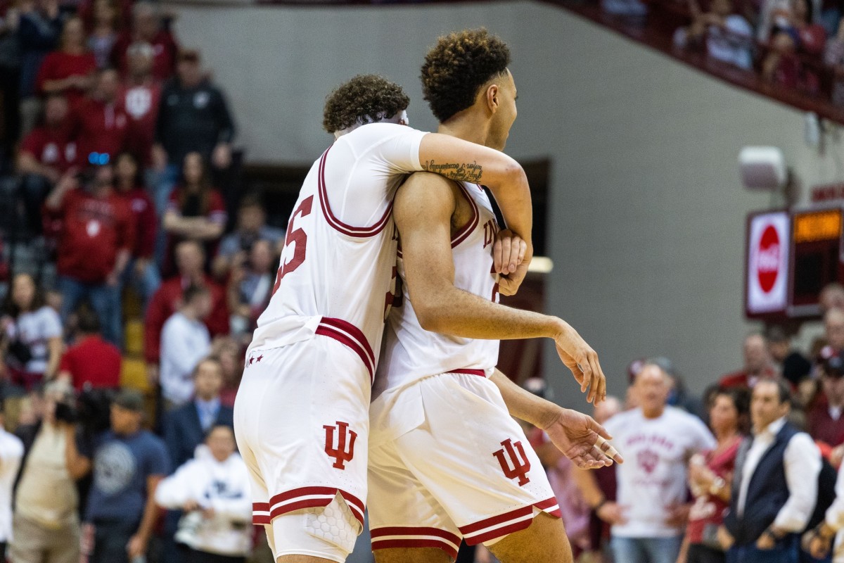Race Thompson (25) and forward Trayce Jackson-Davis (23) celebrate the win against the Michigan Wolverines.