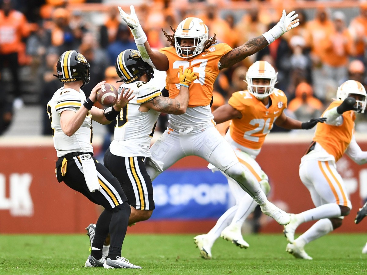 Missouris defensive back Dreyden Norwood (20) protects quarterback Brady Cook (12) from Tennessee linebacker Jeremy Banks (33) during an NCAA college football game against on Saturday, November 12, 2022 in Knoxville, Tenn. Ut Vs Missouri