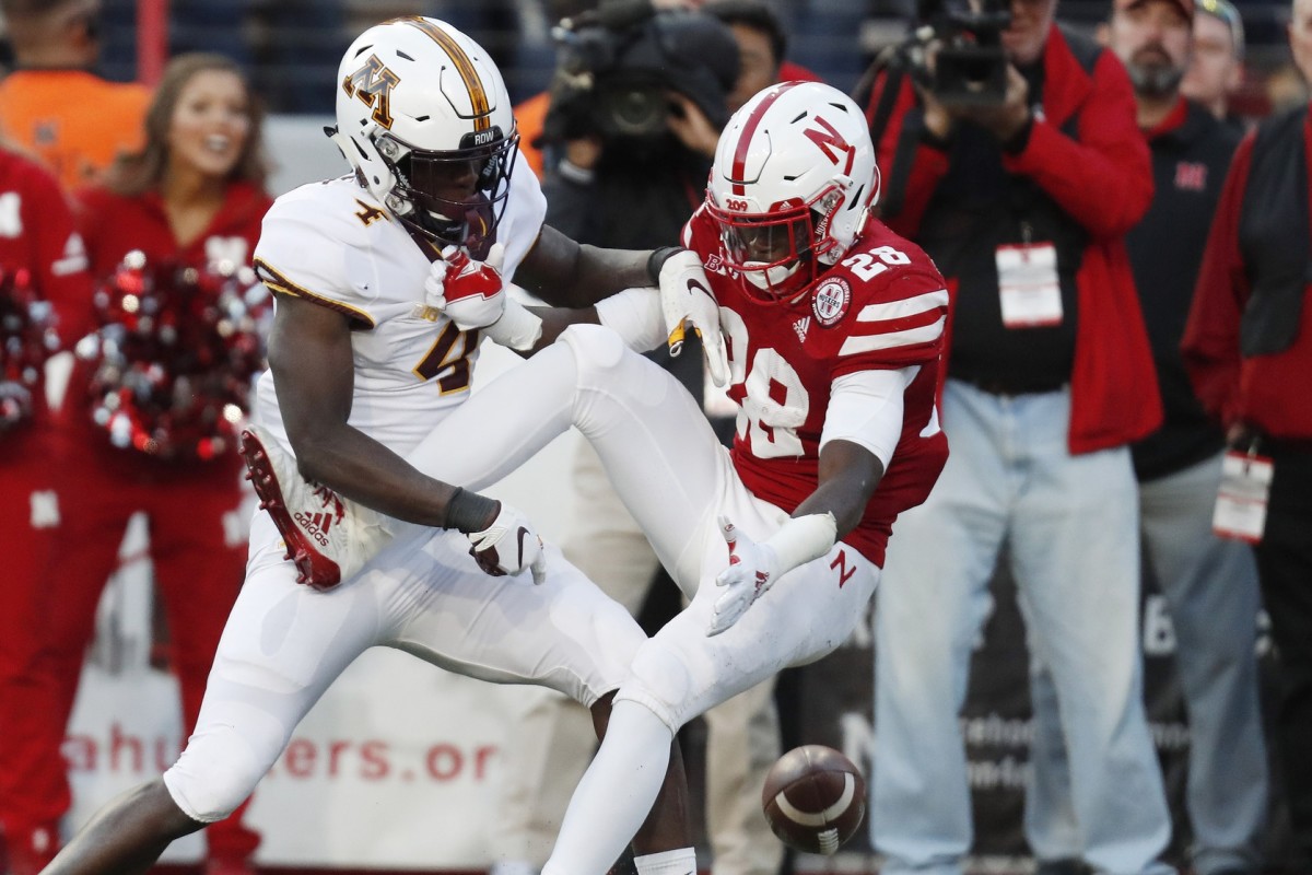 Oct 20, 2018; Lincoln, NE, USA; Minnesota Golden Gophers defensive back Terrell Smith (4) breaks up a pass intended for Nebraska Cornhuskers running back Maurice Washington (28) in the second half at Memorial Stadium. Mandatory Credit: Bruce Thorson-USA TODAY Sports