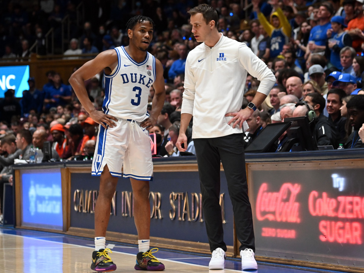 Duke coach Jon Scheyer talks to guard Jeremy Roach during a timeout against Virginia Tech.